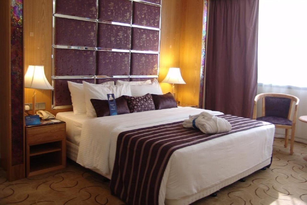 Radisson Blu Resort, Schardscha Exterior foto A bedroom in a hotel
